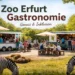 Food-Trailer im Zoo mit Besuchern und Blick auf Zebras – neue Zoo Erfurt Gastronomie erweitert das Angebot des Zooparks.