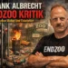 Zwischen Dialog und Eskalation: Das widersprüchliche Comeback von Frank Albrecht vom Projekt Endzoo 9 Frank Albrecht Endzoo Kritik: Tierrechtler vor Zoo-Kulisse mit Müll und gefangenem Affen als Symbol für Eskalation