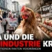 PETA Eierindustrie Kritik: Aktivisten stehen einer modernen Hühnerhaltung gegenüber und symbolisieren den Konflikt zwischen Emotion und Realität.