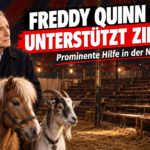 Freddy Quinn unterstützt Zirkus Traber in einem traditionellen Zirkuszelt vor leeren Rängen.