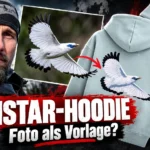 Robert Marc Lehmann neben einem Balistar-Foto und dem Balistar-Hoodie für 99 Euro. Auffällige Ähnlichkeiten zwischen Fotografie und Stickmotiv stehen im Mittelpunkt.